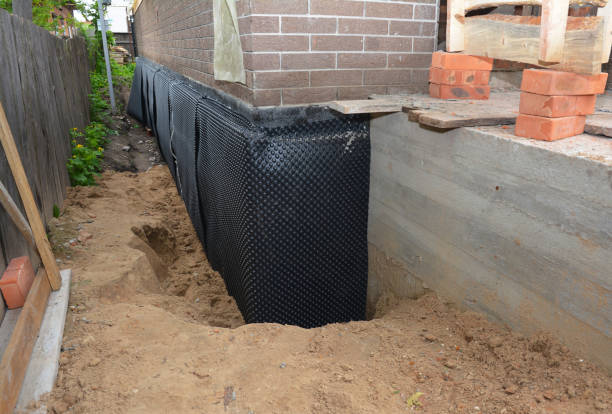 Happy homeowners after waterproofing job in Glen Burnie